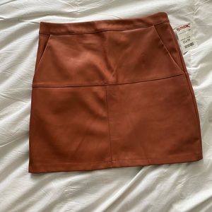 Burnt orange/ camel “leather” mini skirt size M